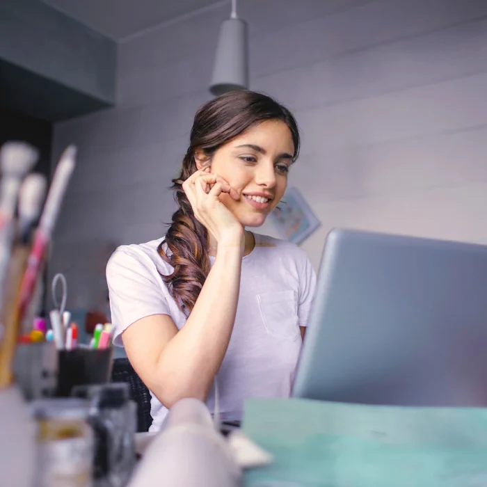 A professional smiling in a bright office